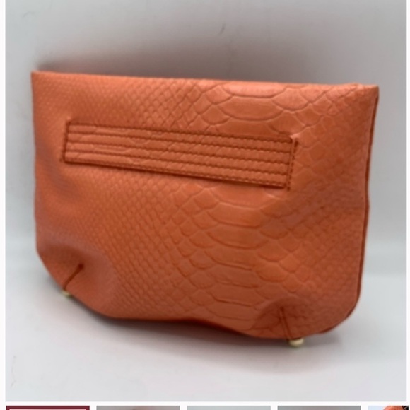 Beautiful Korto Momolu Clutch
Fun pattern,Coral colored exterior, EUC - Picture 1 of 7